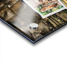 Artist drawing ancient temple carvings outdoors. Acrylic print