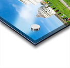 People walk in Piazza dei Miracoli admiring the Baptistry and Cathedral in Pisa. The sun shines on the historic buildings and green grass. Acrylic print