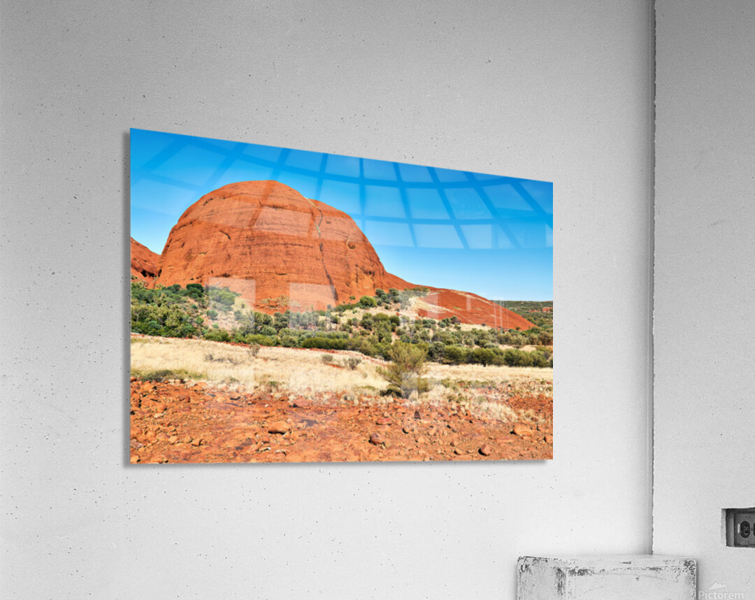 Vast red rock formation under a clear blue sky. Acrylic Print