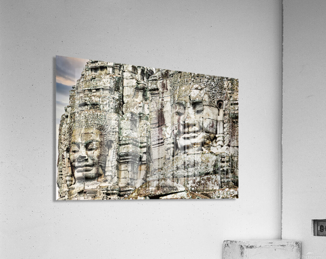 Serene stone faces adorn ancient Cambodian temple. Acrylic Print