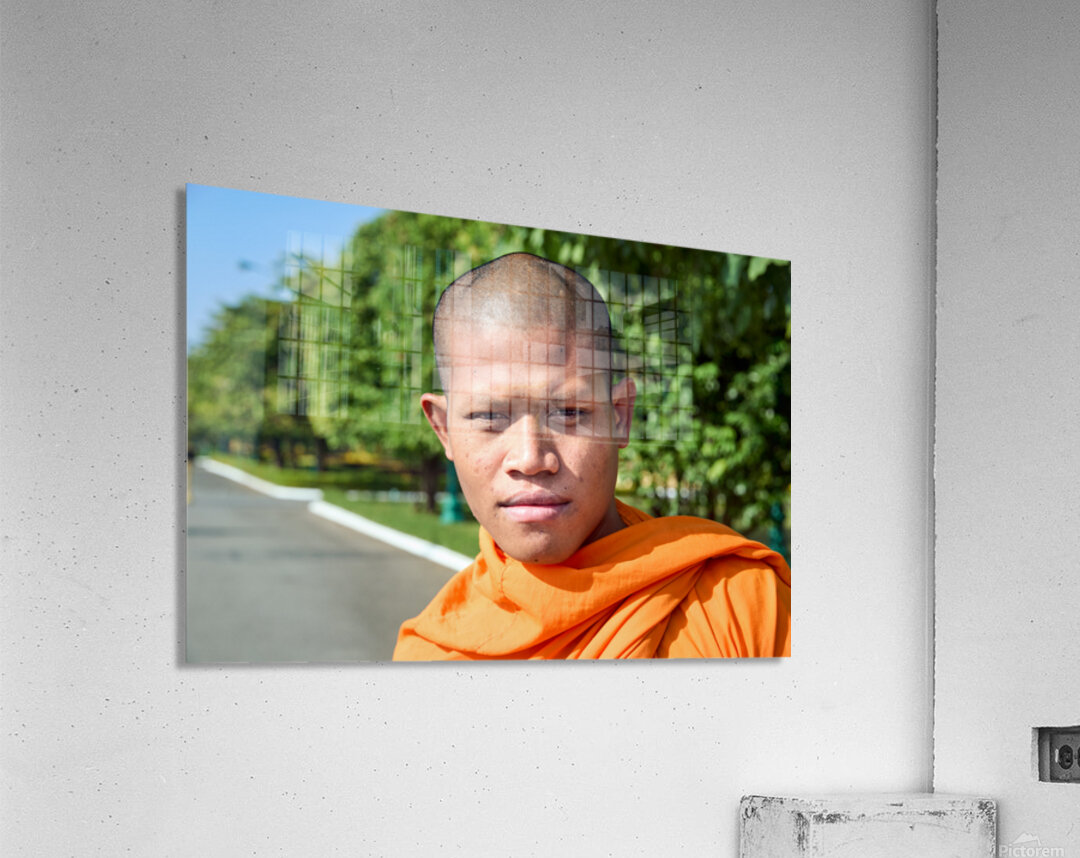 Portrait of a young Buddhist monk in orange robe. Acrylic Print