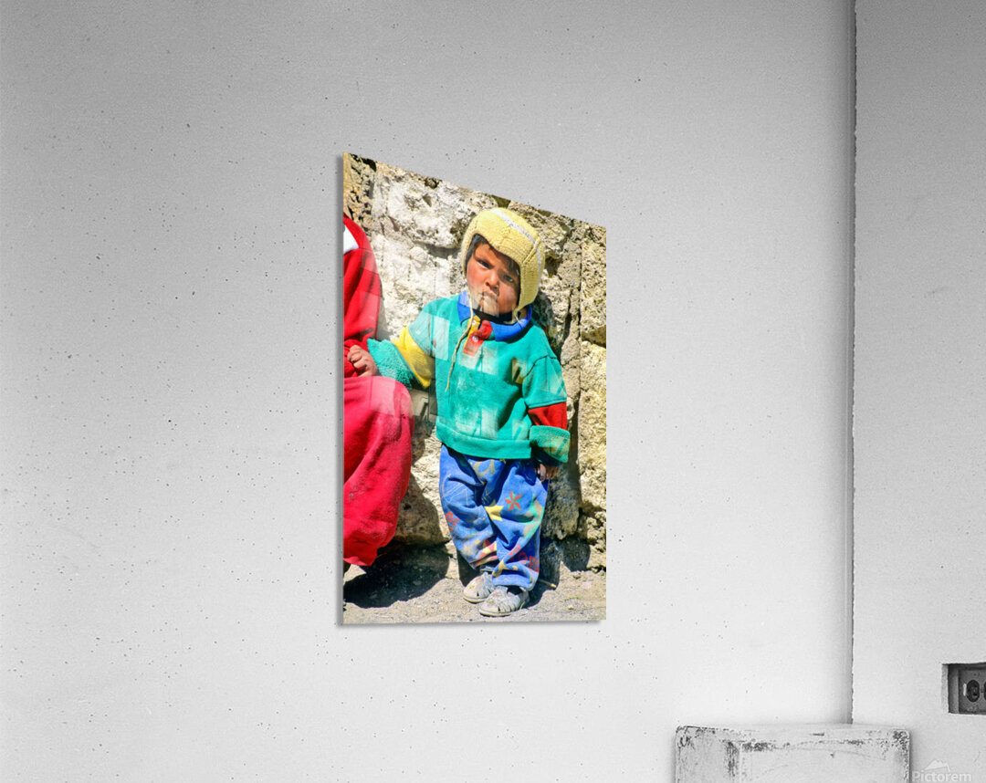 Indigenous child in colorful clothes and yellow hat outdoors. Acrylic Print