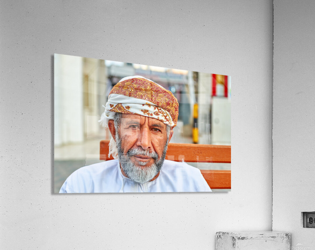 Man sitting on a bench in Muscat Oman during the day Acrylic Print