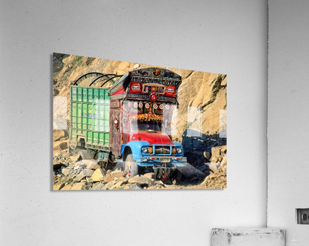 Trucks travel toward Shandur Pass in Pakistans rugged terrain Acrylic Print