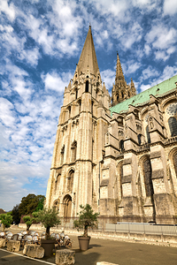 Chartres Cathedral stands tall against the blue sky in Chartres 