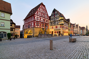 Rothenburg ob der Tauber shows its historic buildings at sunset