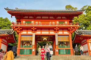 Yasaka shrine temple in Kyoto during a sunny day with visitors