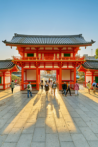 Visitors walk through the main gate of Yasaka shrine temple in K