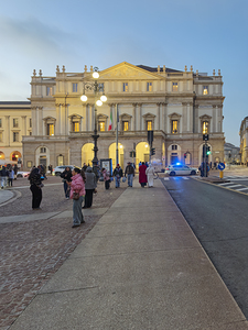 Milan. Italy. La Scala opera house in Milan at dusk with people 