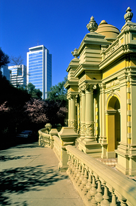 Historic architecture contrasts with modern high rise buildings. by Marco Brivio