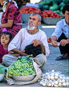 Street vendor selling produce in Samarkand Uzbekistan