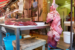 Fresh meat stalls at Piscaria market in Catania Sicily Italy