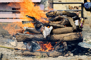 Cremation rite by the Ganges River in Varanasi