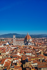 View of Florence with blue sky and domed buildings in Tuscany