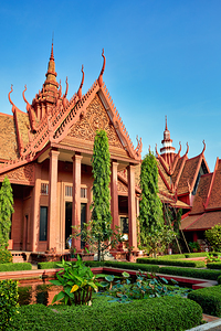 National Museum of Cambodia red building lush garden pond.