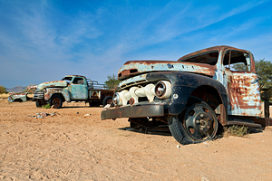 Classic cars wrecks decay in Namibia desert countryside