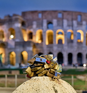 Love keylocks at the Colosseum in Rome Italy during the evening