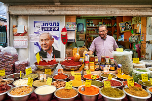 Market scene in Mahane Yehuda with spices and local vendor