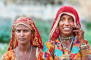 Women in traditional dress pose in Mandawa Rajasthan by Marco Brivio