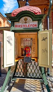Old telephone booth stands in Stockholm Sweden