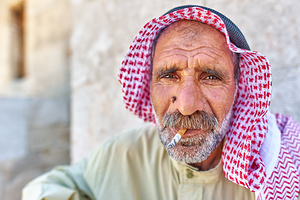 Portrait of a senior man in Aleppo Syria with a cigarette by Marco Brivio