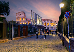 Walk along Via Sacra with views of Colosseum in Rome Italy