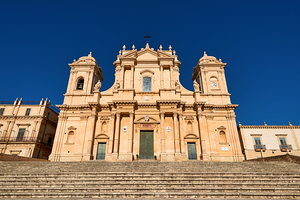 Noto Cathedral stands tall in Sicily under a clear blue sky