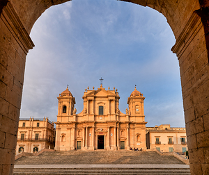 Noto Cathedral stands tall in Noto Sicily during sunset hours