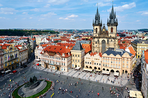 Historic Prague Old Town Square Týn Church and city view.
