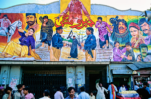 Wall art outside cinema in Lahore showing local culture and life