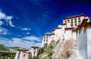 Majestic Potala Palace stands in Tibet under a bright blue sky