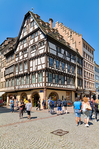 Visitors enjoy timber frame houses in Place du Chateau in Strasb