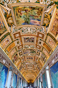Visitors admire the ceiling of the Gallery of Maps in Vatican Ci