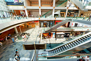 Shoppers browse stores at Marina Bay Sands Mall in Singapore
