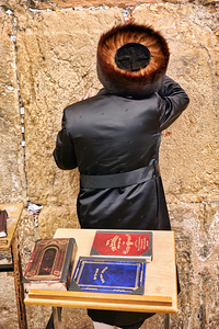 Prayers at the western wall in jerusalem by orthodox jews