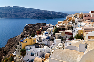 Santorini village on cliff overlooking the Aegean Sea.