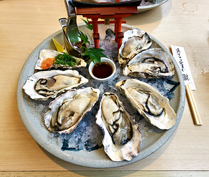 Fresh giant oysters served in Miyajima Hiroshima region of Japa
