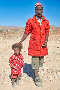 Father and daughter stand together in Palmwag Kunene Region