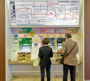 Buying tickets at a metro station in Tokyo Japan during the day