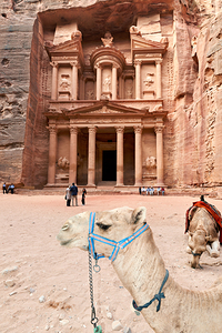 Tourists visiting Al Khazneh the Treasury in Petra Jordan with 