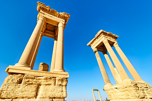 Tetrapylon structure in ancient Palmyra of Syria under clear sky