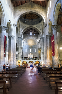 Visitors explore Santa Maria della Pieve in Arezzo Italy