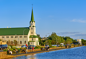 Lutheran free church by lake tjornin in reykjavik iceland