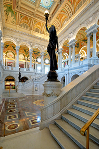 Inside Library of Congress with statue and stairs