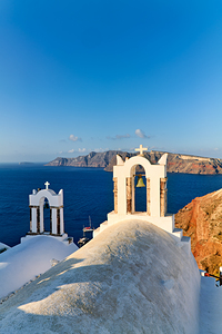 Santorini church bells overlooking the Aegean Sea.