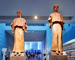 Visitors explore the Acropolis Museum in Athens while viewing st