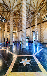 Tourists visit Lonja de la Seda in Valencia Spain during daytime