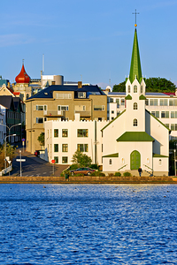 Lutheran free church by lake tjornin in reykjavik iceland