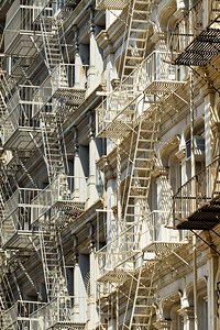 Fire escapes on buildings in Manhattan show city life and design
