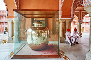 Visitors observe a large silver pot in Jaipur City Palace
